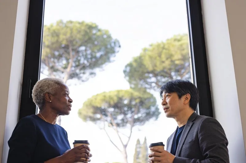 University leaders from different continents in conversation.