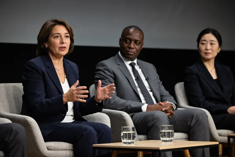 A minister and university leaders on a plenary panel.