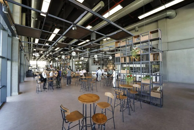 The open foyer of the NEST Convention Center, filled with daylight.